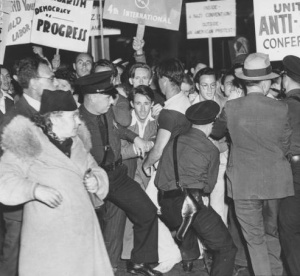 United Anti-Nazi Conference protesting, with the police restraining them.